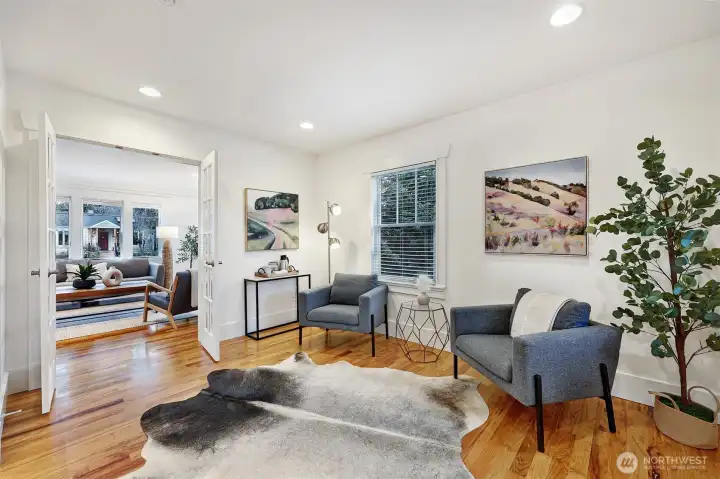 Den has French doors into the living room.