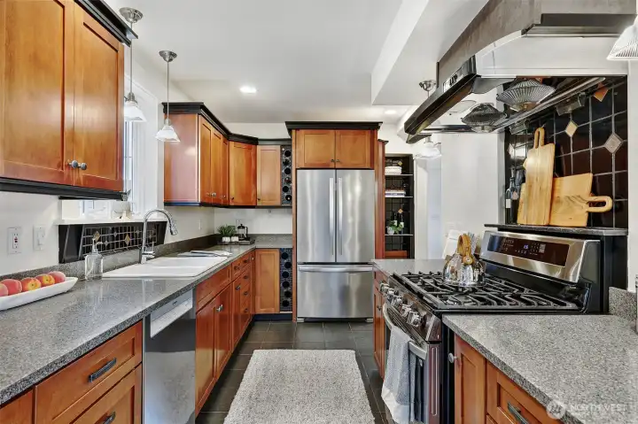 Stylish kitchen with gas range, ample counterspace and cabinets.
