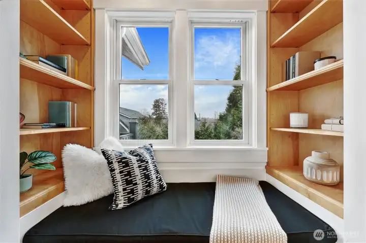 Charming built-in shelves and cedar storage bench in master with lovely territorial views
