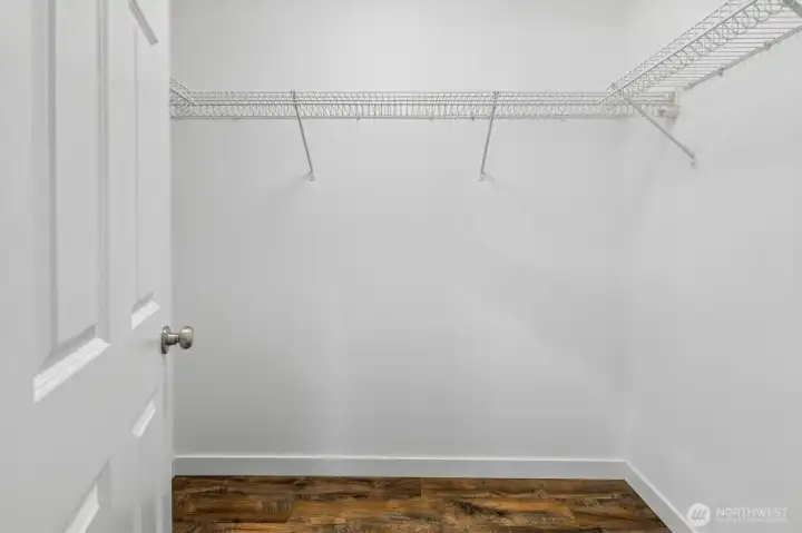 Primary bedroom walk-in closet