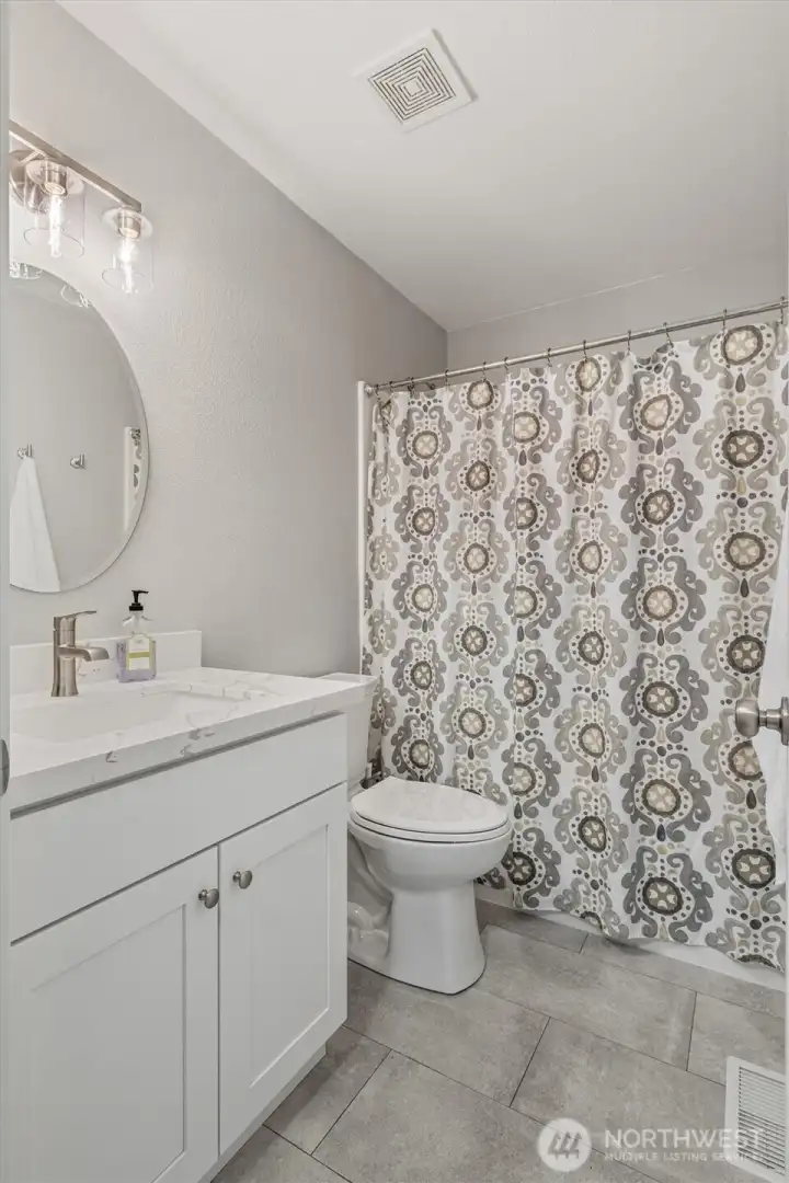 Guest full-bath Fully remodeled with a polished urban-inspired vibe