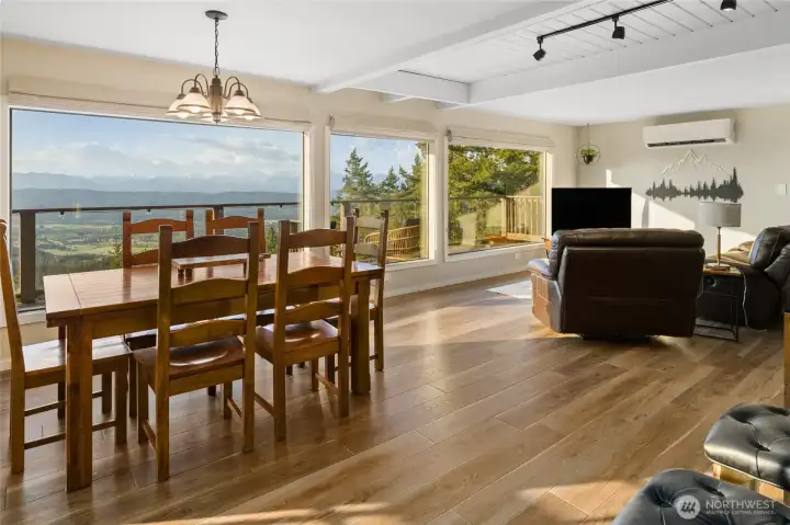 Dining room and living room with huge windows and gorgeous views of the Stuarts.