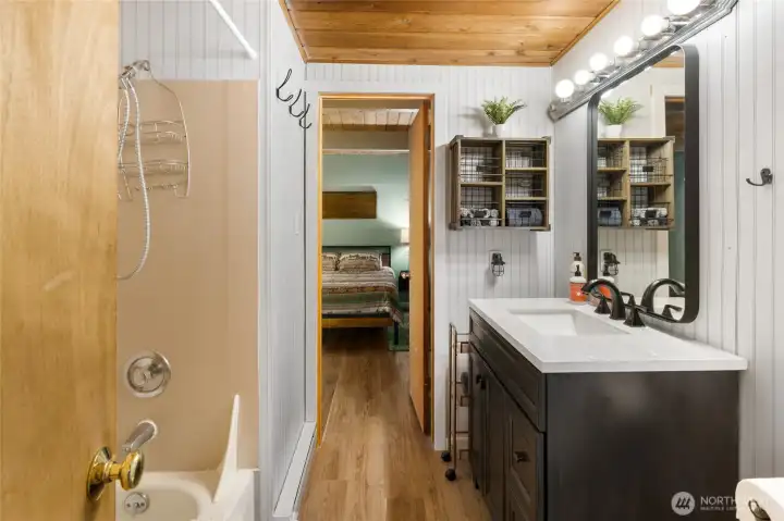 Main floor bathroom and primary bedroom.