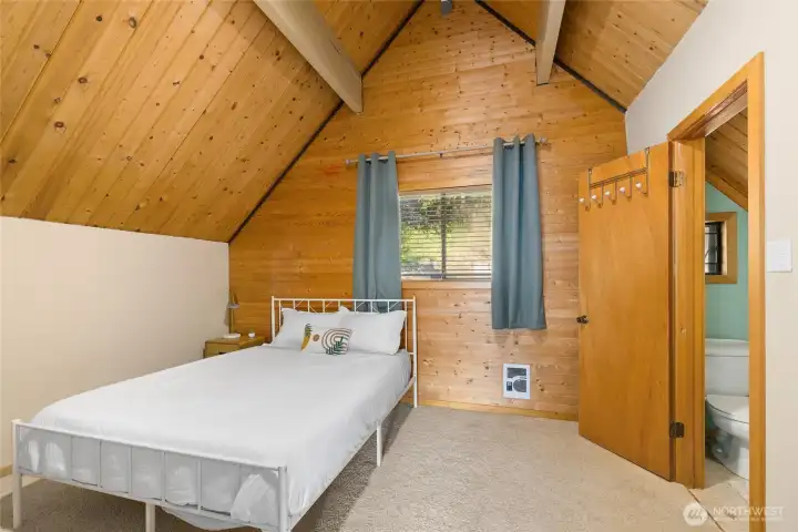 Upstairs bedroom with half bath.