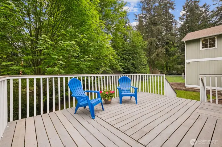 Enjoy complete privacy on your large, Trex deck with a greenbelt backdrop that acts as your own personal sanctuary. The outdoor space is ideal for gatherings, play, or quiet moments in nature. The expansive Trex deck overlooks the lush yard and second tax lot. It’s the perfect setting for outdoor dining, morning coffee, or evening relaxation.