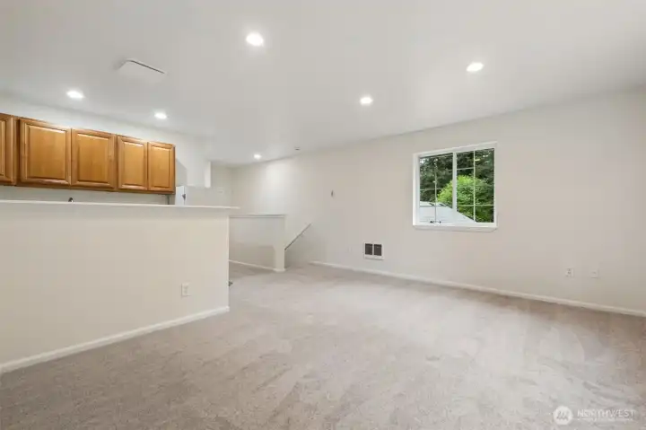 This spacious studio feels like a private getaway tucked above the main home. Large windows and open space make it perfect for an office, gym, or art studio.