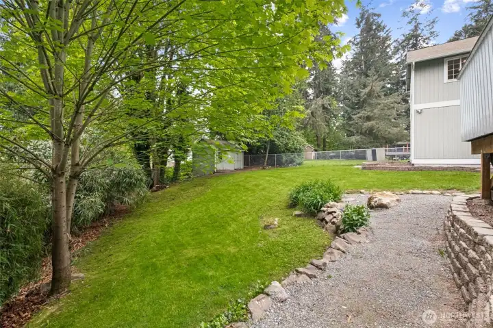 The .62-acre double lot provides room to roam, garden, or simply enjoy the peaceful surroundings. Few properties in Maple Hills offer this level of space and seclusion.
