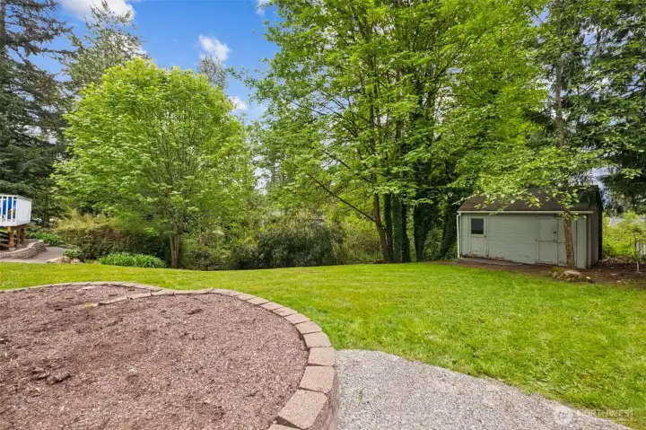 The expansive yard includes a 12' x 16' shed to store your outdoor items, adding valuable functionality to the outdoor space.