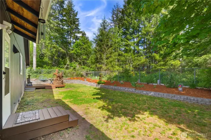 backyard with side door into garage