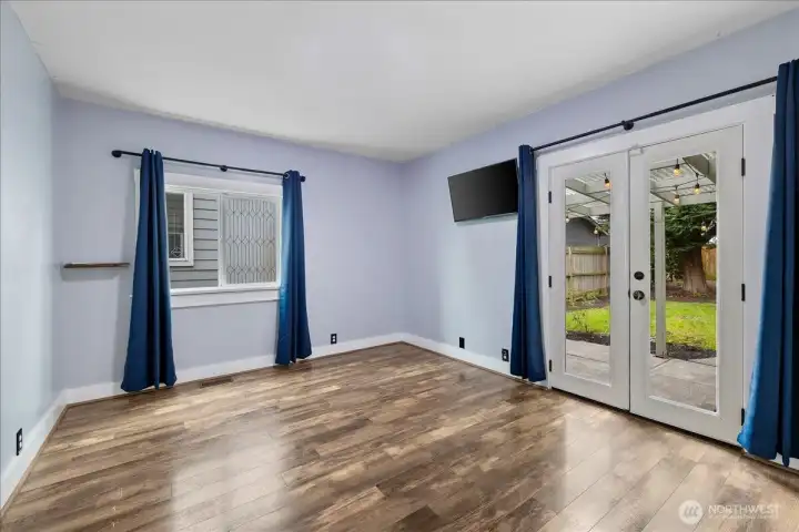 Primary bedroom on main floor with french doors out to patio