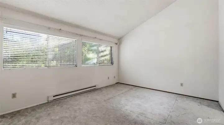 Primary suite with vaulted ceilings, dual closets and attached full bath Primary suite with vaulted ceilings, dual closets and attached full bath