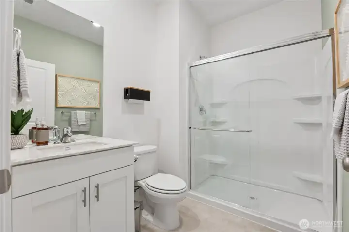 This bright 3/4 bath conveniently located downstairs. Photos are representative only and may display different colors and or upgrades.