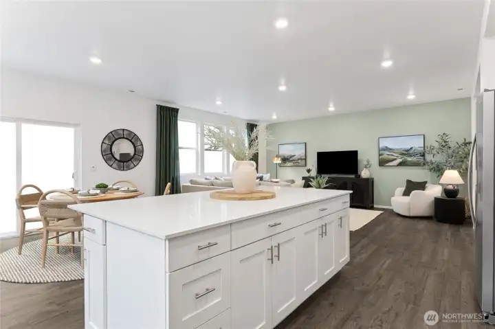 Looking from the kitchen island toward the living room, this photo captures the stunning open-concept flow of the main level, with the dining area and great room seamlessly connected. Photos are representative only and may display different colors and or upgrades.