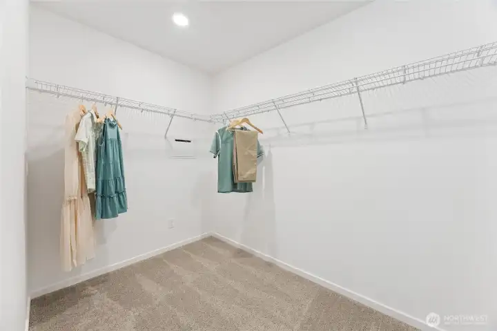 The spacious owner's suite walk-in closet offers generous storage with plenty of wire shelving. Photos are representative only and may display different colors and or upgrades.