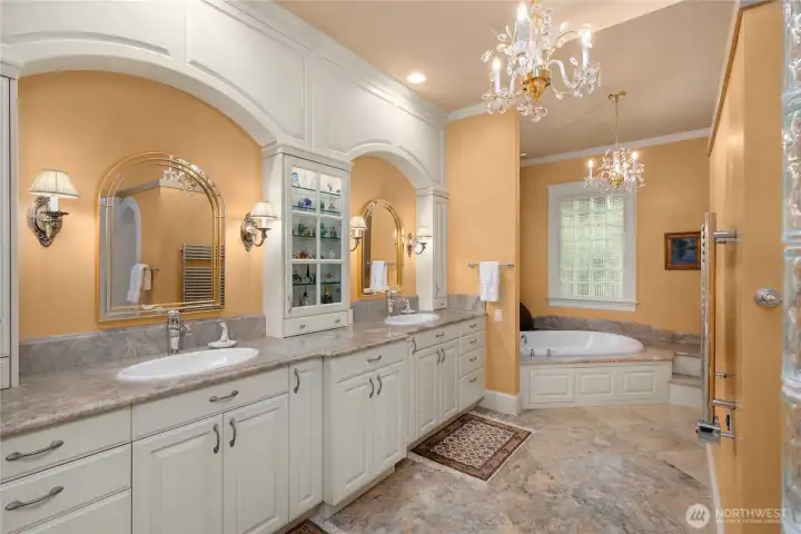 The primary en-suite is enormous with two sinks, vanity space, walk in shower and soaking tub.