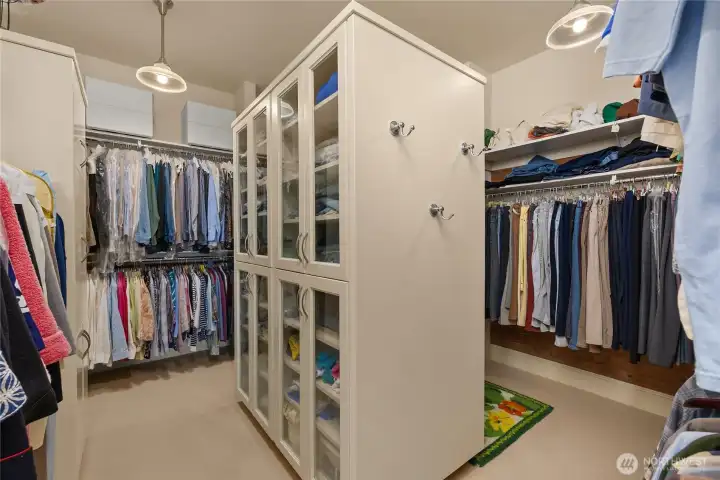 The walk-in closet with plenty of storage. Opens to the laundry room.