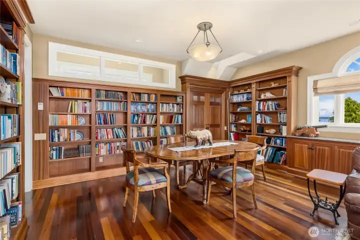 The bookshelves are absolutely stunning and show off the expert woodworking of the home.