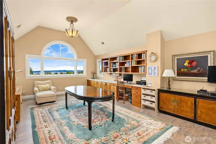 The studio space on the upper level has beautiful built-ins and is ideal for artists, musicians, writers, creators. Dead center view of Rainier