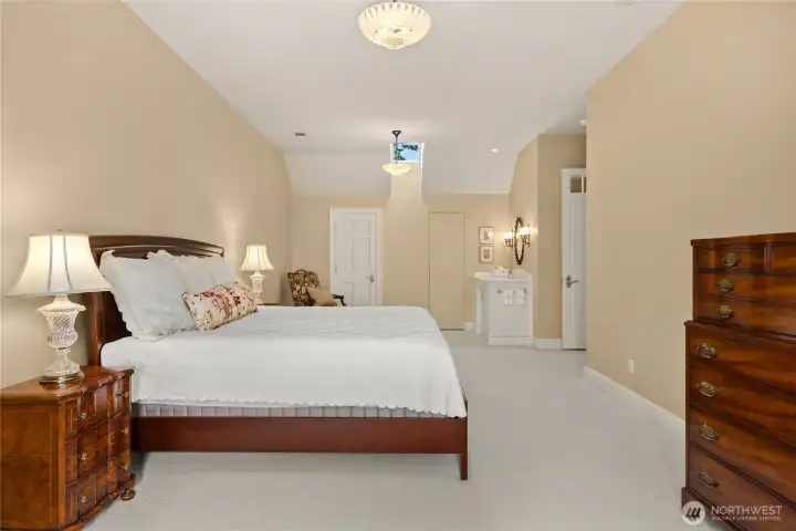 The second upper floor bedroom with extra storage and a sink in the room.