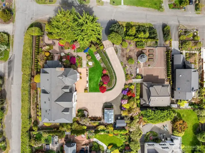 Aerial view shows the entire property with main house to the left and guest house with separate entrance to the right.