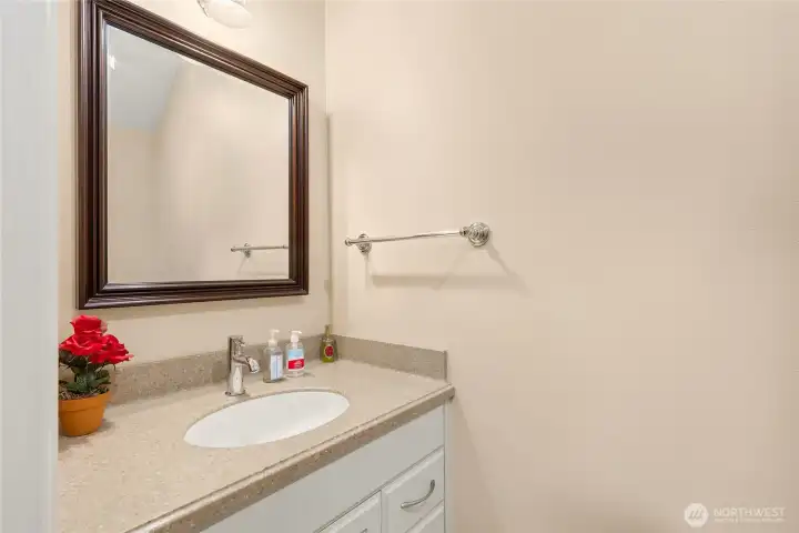 The half bath on the lower floor of the guest house. The guest house also has laundry and extra storage.