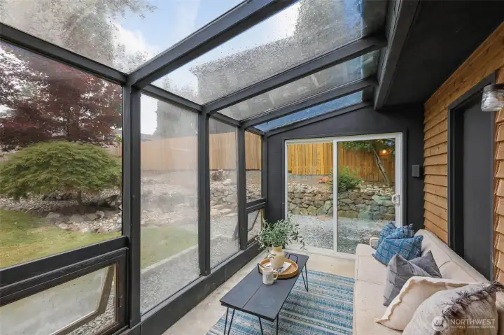 Enjoy morning coffee + quiet evenings in the covered sunroom. Enjoy morning coffee + quiet evenings in the covered sunroom.