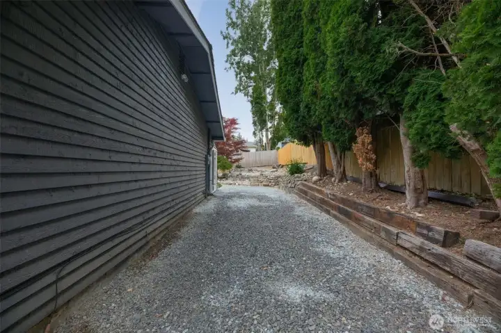 Side yard with room for boat +trucks + outdoor storage. Side yard with room for boat +trucks + outdoor storage.