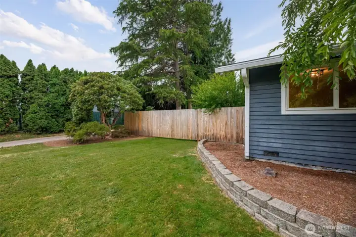 A huge front yard with room to entertain + play + garden. A huge front yard with room to entertain + play + garden.