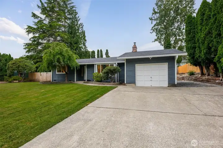 Attached garage + spacious driveway make coming home easy. Attached garage + spacious driveway make coming home easy.