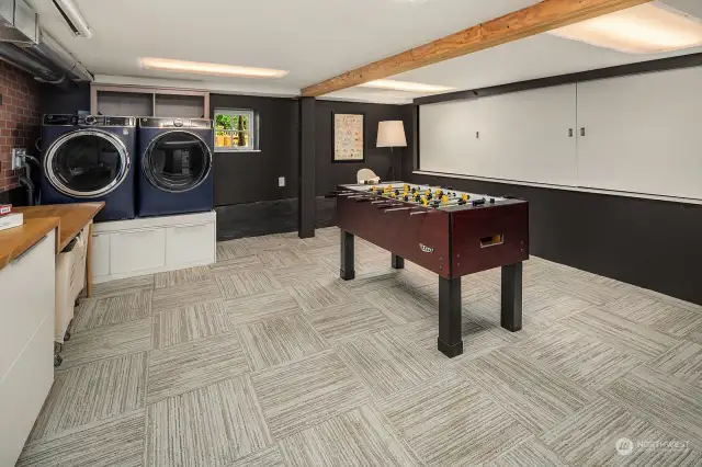 The lower level laundry room also offers plenty of space to hang out as well as additional storage.  Seller had a projector tv setup in this space - great for movie nights!