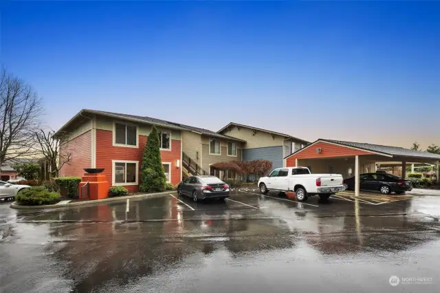 Our home is the lower single level unit. showing carport near the white truck.