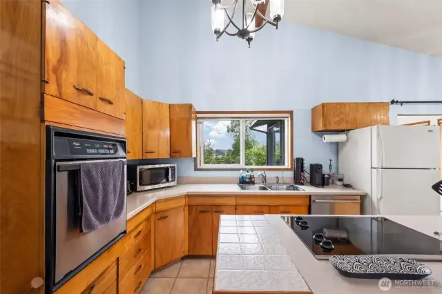 Kitchen with views of backyard
