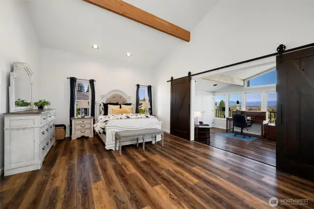The upper-level primary suite isn’t just a bedroom—it’s a private sanctuary. With a spacious layout that flows into a flexible bonus/ third bedroom, a private balcony and a loft-style office just beyond, this elevated retreat offers room to unwind, work, create, or simply breathe. Whether you envision a peaceful reading nook, an art studio, or a luxe lounge, the possibilities are endless.