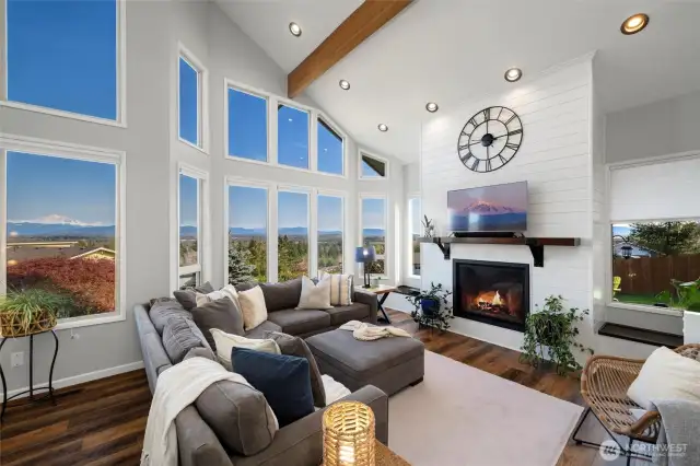 Vaulted Elegance Meets Breathtaking Views- Soaring 20+ foot ceilings and walls of windows draw in natural light and frame unforgettable vistas of Mt. Baker, the Twin Sisters & the San Juan Islands. This is more than a home—it's a statement.