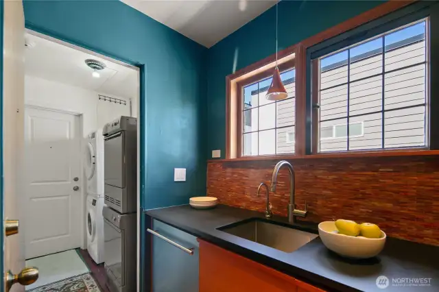 Paperstone counter tops (also in bathroom.) Dedicated Asko washer/dryer on back stair landing.
