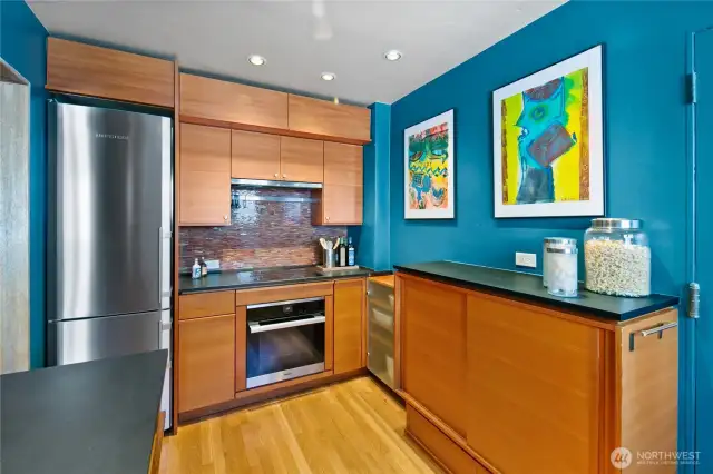 Liebherr refrigerator, Miele oven and Wolf Induction cooktop. Range hood vented to the outside