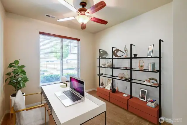 Den in the front of the home overlooks the front landscaping and features closet for extra storage. Photo Virtually Staged