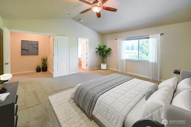 Spacious primary bedroom overlooks the backyard and features a view of the mountain! Photo virtually staged.