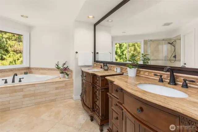 Dual vanities and large soaking tub in the primary.
