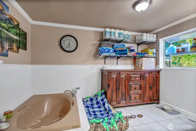 The main bath offers a spa-like retreat with a deep soaking tub and a separate walk-in shower. The room is generously sized, giving you plenty of space to move around and unwind in comfort.