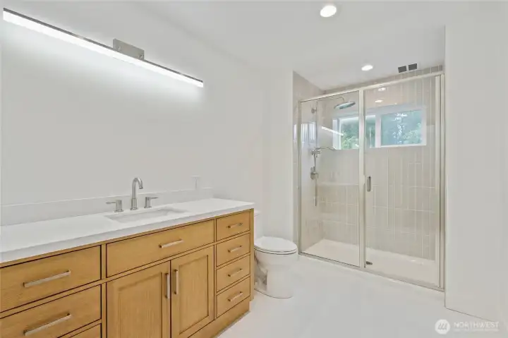 Primary Bath: Shower includes double shower heads and window. Radiant floor heat.