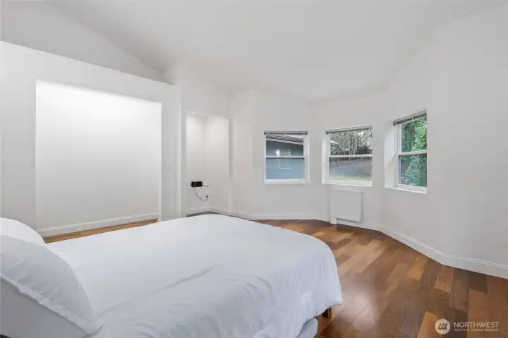 Second Bedroom:  Small nook for possible home office desk. Extra tall closet space with additional storage space above. Light in closet area.