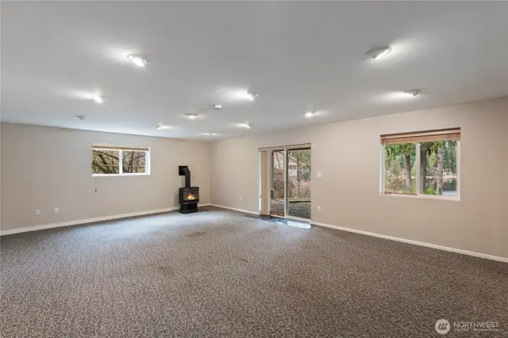 Lower level living room: woodstove heating.
