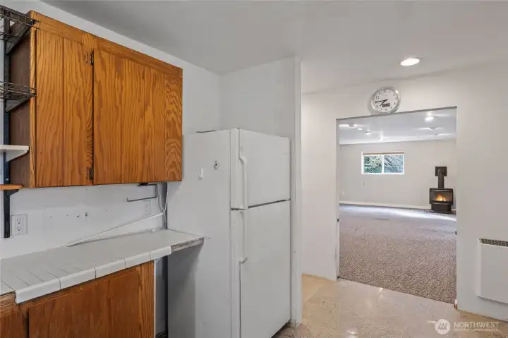 Lower level kitchen with view to living room.