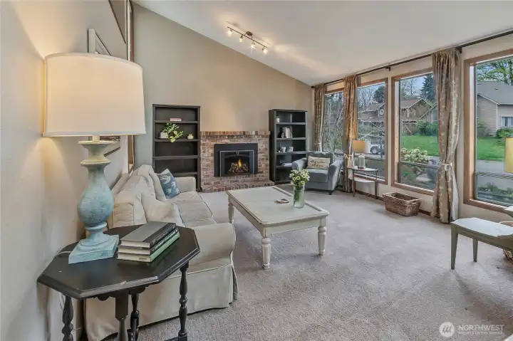 Cozy family room with gas fireplace overlooks the front of the house.