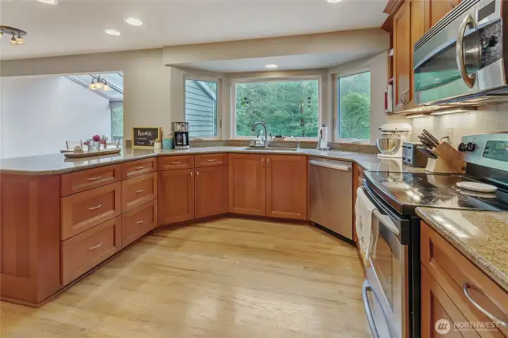 Beautiful granite countertops and custom cabinetry.