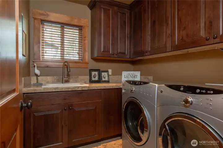Adjacent to the guest bath is a large laundry room