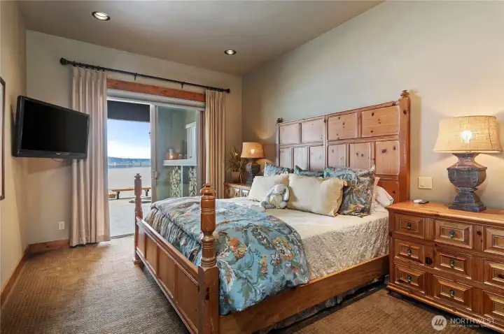 Primary suite on main floor with sliding door to the back patio