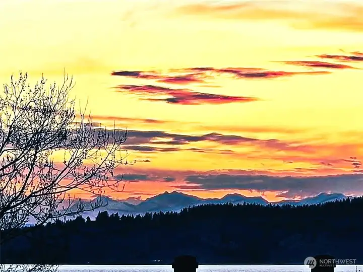 Not just sunsets, but sunsets over the water and mountains!