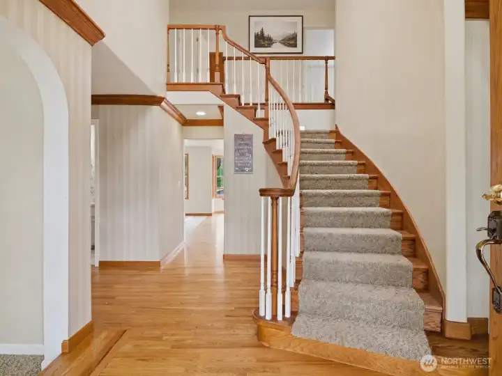 Grand entrance with formal sitting to left, and formal dining to the right.